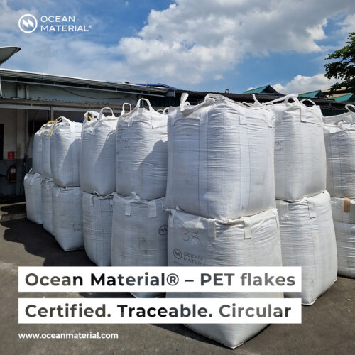Final product: certified PET flakes from Ocean Material® stored in large sacks, ready for delivery. Text overlay reads: “Ocean Material® – PET flakes. Certified. Traceable. Circular”.